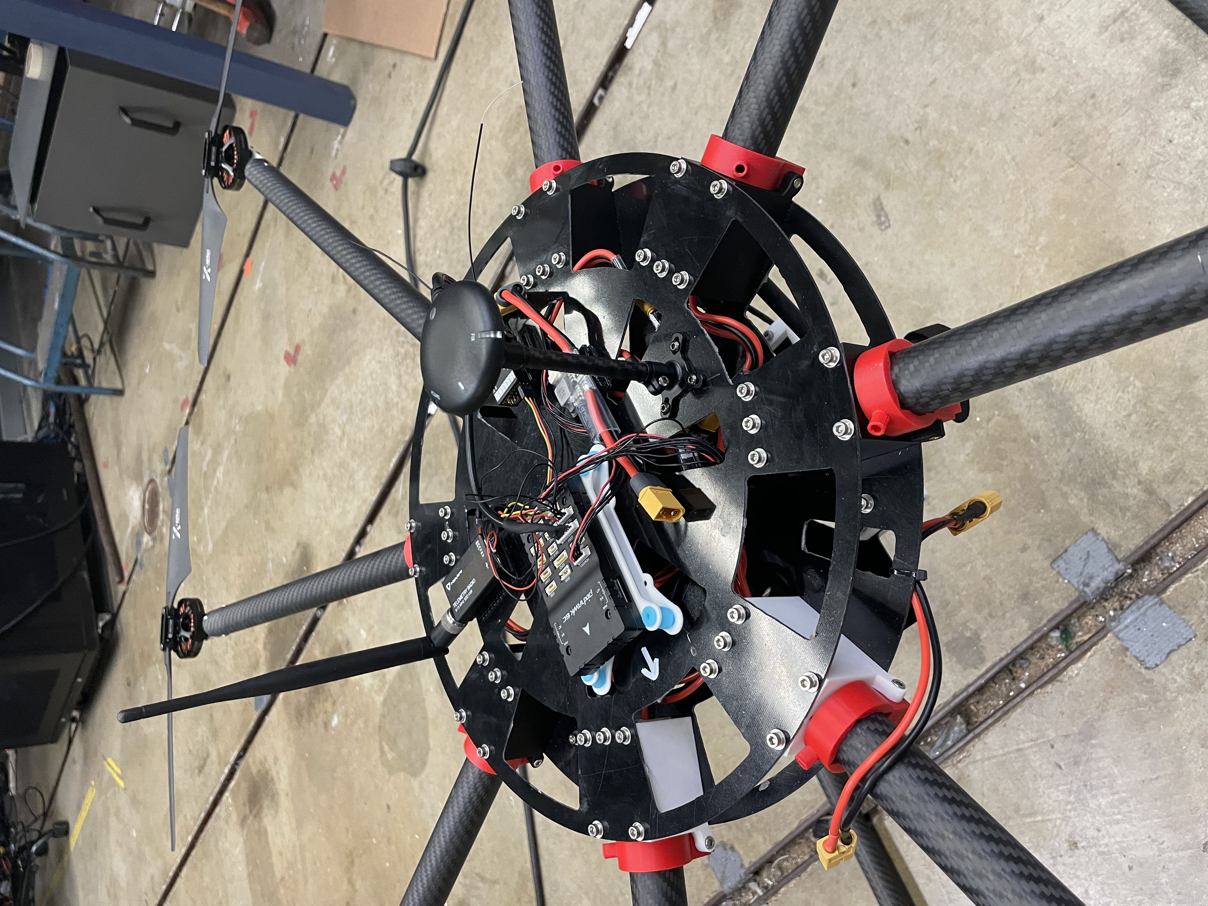 Pixhawk 6C flight controller and telemetry radio mounted in the central avionics tray